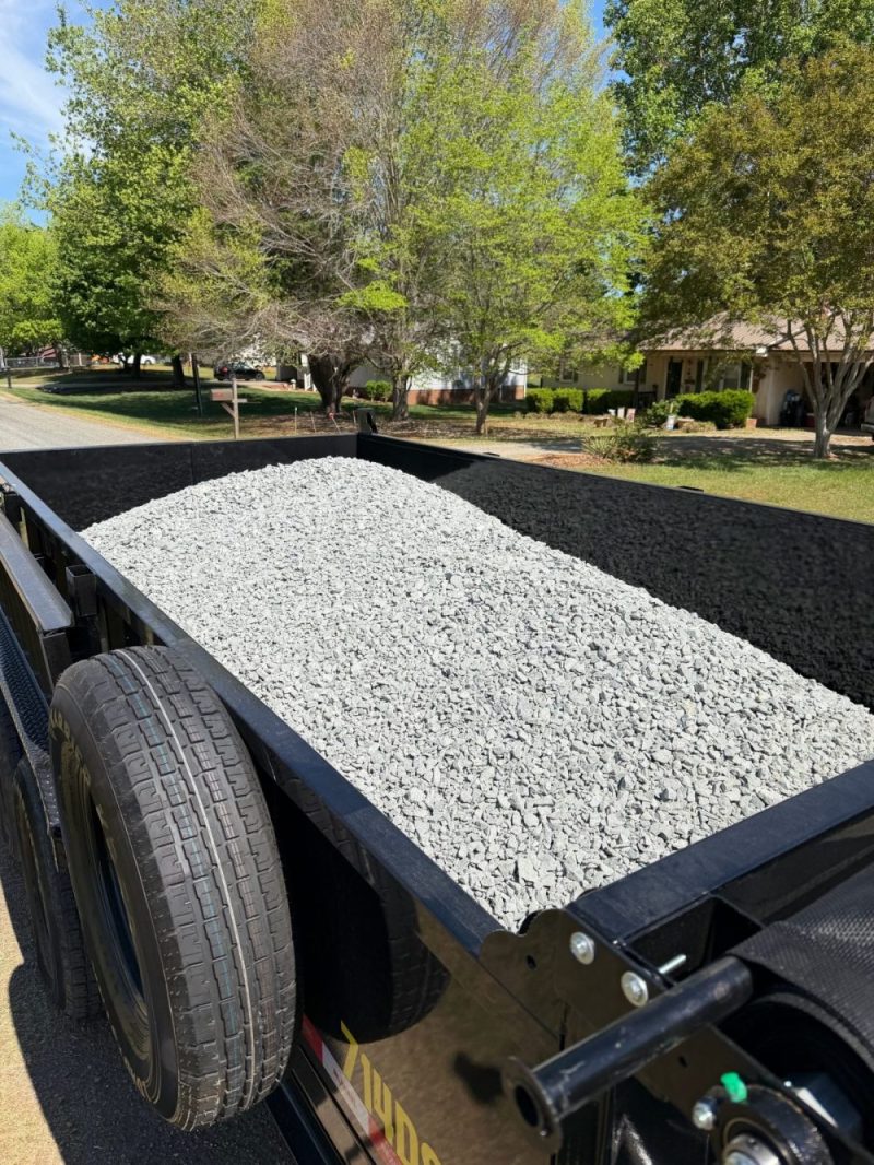 dump trailer filled with a load of crushed gravel
